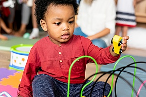 a child playing with toys at a daycare