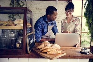 Small business owners on laptop