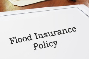 Flood Insurance Policy on an office desk