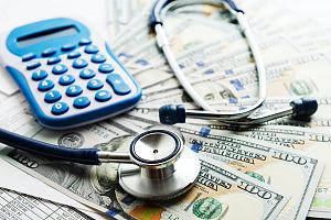 Stethoscope on saved money from health insurance 