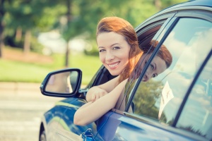 women smiling out her car with family of 3 happy with their Personal Insurance Policies
