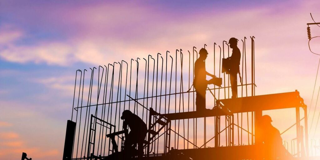 engineer standing orders for construction team to work safely on high ground