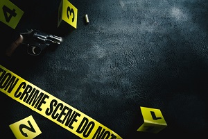 crime scene concept with a gun and evidence markers