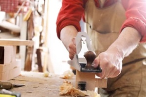 woodworker during work process with woodworking insurance