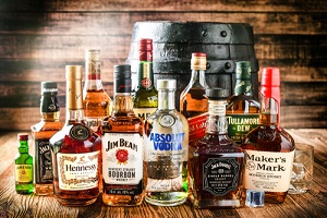whiskey bottles and whisky barrel