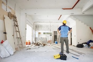 worker looking at home renovation project
