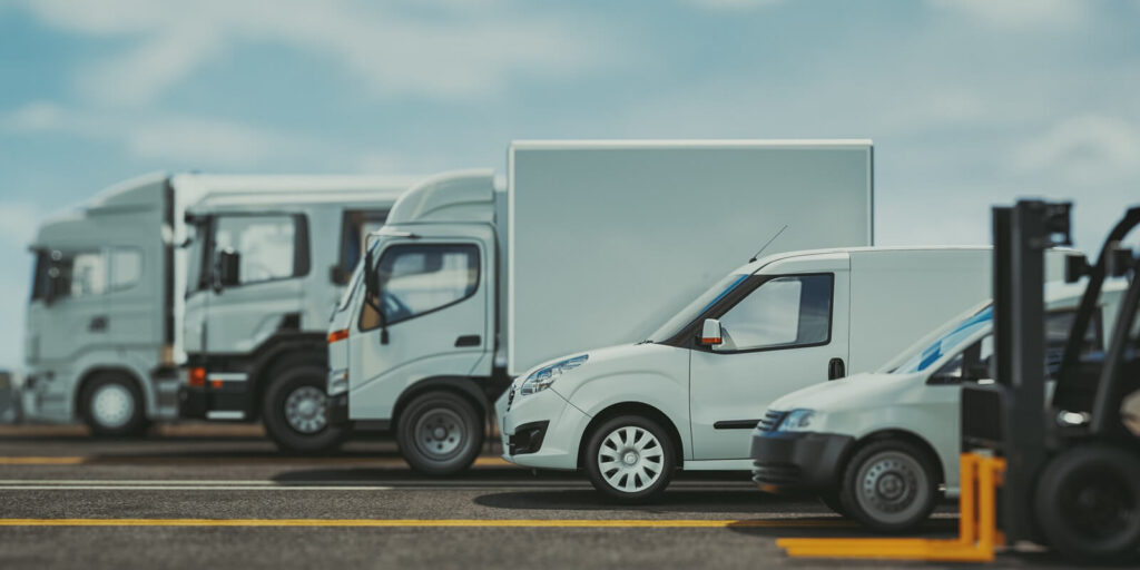 trucks of various sizes on the road