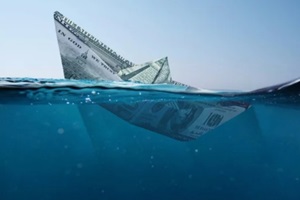 concept paper dollar boat sinking in the sea with a view underwater