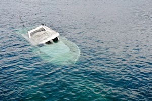 power boat sinked in the sea coast