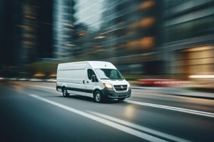 commercial delivery van on the street with motion blur background