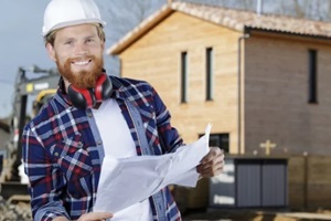 happy male worker making a work plan 