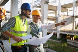 architect and engeneer on building site check documents